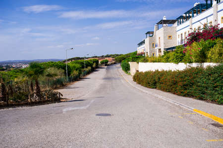 A nice street with white wall of the house in a town of Portugalの写真素材