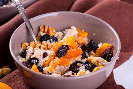 Oatmeal with raisins, dried apricots, plumsの写真素材