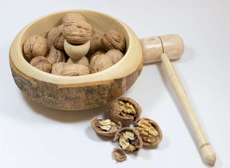 Walnuts with nutcracker. Isolated white background. Nuts.の写真素材