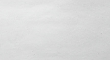 A high-resolution close-up texture of white or light grey recycled paper with a slightly rough and fibrous surface. This simple and minimalist background can be used to add an authentic feel to designs or to create a clean base for text or graphics. Ideal for craft, art, and stationery themes.の素材