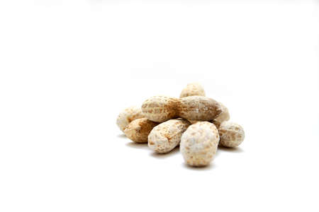 salted peanuts on white surface to be used as background