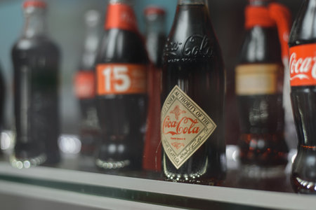 glass bottle of coca cola behind the showcase.のeditorial素材