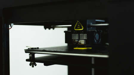 Process of printing physical plastic model on automatic 3d printer machine. Additive technologies,...