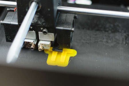 Process of printing physical plastic model on automatic 3d printer machine. Additive technologies,...