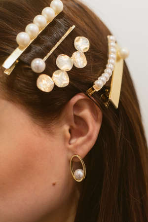 Stylish hairpins for a dark-haired girl. Pearl Earrings