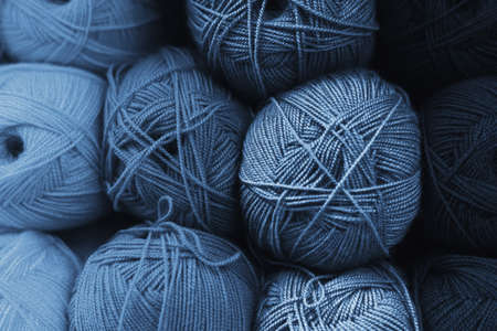 Skeins of wool in all shades of classic blue. Handmade concept. The color of the year 2020 is classic blue. Gradient color. Background made of blue skein of yarn. Sewing conceptの写真素材