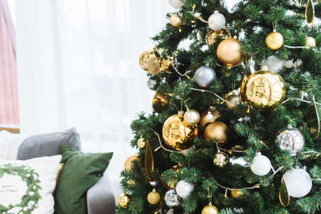 New Year fir tree with decorations and illumination. Xmas tree decorations background. Many large...