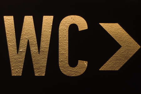 Plate of female and male toilet. Stencil and pointer to the restroom WC.の写真素材