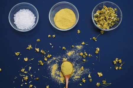Close up of Ingredients of ayurvedic treatment or face pack. Yellow clay, turmeric powder and dried...