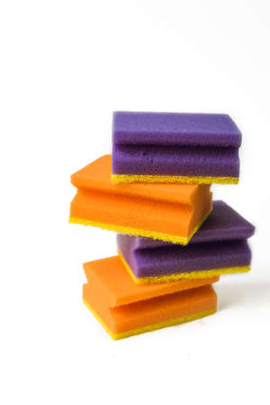 A stack of cleaning sponges isolated on a white background. The concept of cleaning, cleansing and bleaching.の写真素材