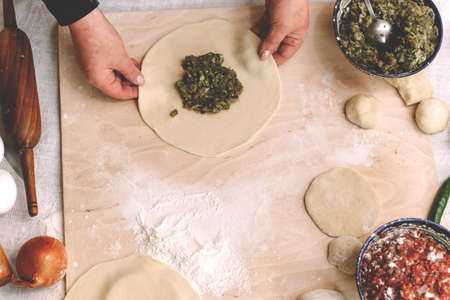 Making dumplings, manti and khinkali from minced beef, lamb and dough. homemade food.の写真素材