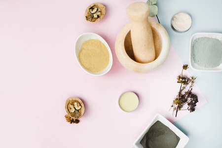 Various ingredients for home skin care. Marble mortar for mixing clay, eucalyptus sheets, walnuts to obtain a balm or cream. Moisturizing and cleansing the skin.の写真素材