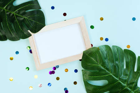 Tropical botanical background with a space for a text, view from above. Palm branches on white mock up.の写真素材