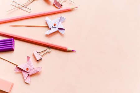 Stationery on a pink background with place for text. Monochrome color banner. Concept of back to school. Copy space.の写真素材