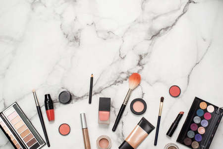 Decorative cosmetics on a marble background with mine space. Beautiful background for a blog about...
