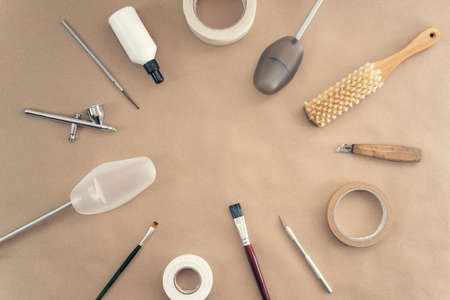 Tools for polishing, cleaning and repairing shoes on a craft background. Copy spaceの写真素材