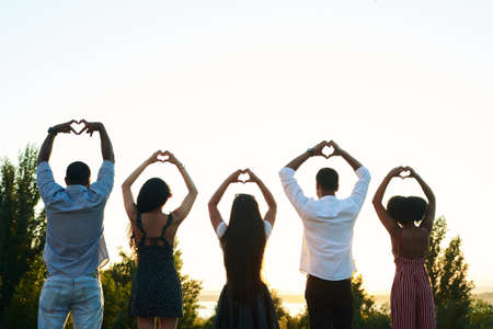 Black people are showing a heart. Black people are having fun together.の写真素材