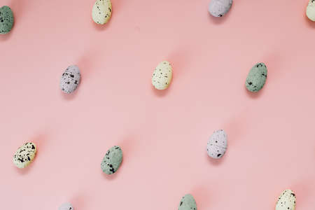 Quail eggs pattern. Different quail eggs on pink background. Easter concept. Flat lay, top view,...