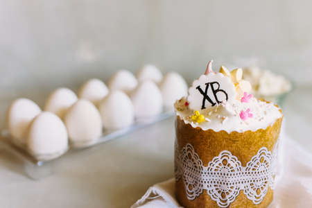 Happy Easter. Congratulation easter background. Sweet Easter cake on a light gray background. The concept of a bright holiday.の写真素材