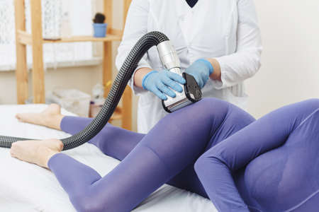 Cosmetologist. Lymphatic drainage massage LPG apparatus process. LPG massage for lifting body.の写真素材