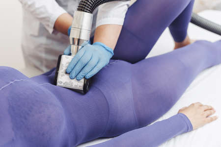 Cosmetologist. Lymphatic drainage massage LPG apparatus process. LPG massage for lifting body.の写真素材