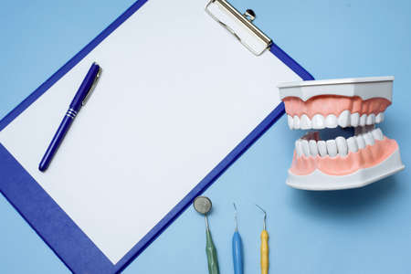 White blank tablet on the medical table in the stomatology. Medical or Healthcare conceptの写真素材