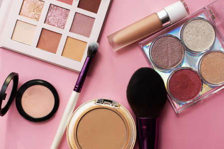 Decorative cosmetic set on a pink background. Copyspace. Makeup artists beauticianの写真素材