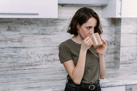happy female holding cup of tea, pretty girl drink at home, health care and dieting conceptの写真素材