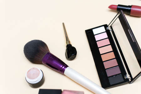 Set of professional decorative cosmetics, makeup tools and accessory on colored background. Beauty, fashion and shopping concept. Flat lay composition, top viewの写真素材