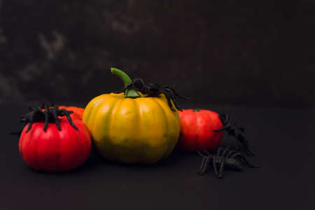 Halloween orange pumpkins with spiders. Happy halloween overhead black backgroundの写真素材