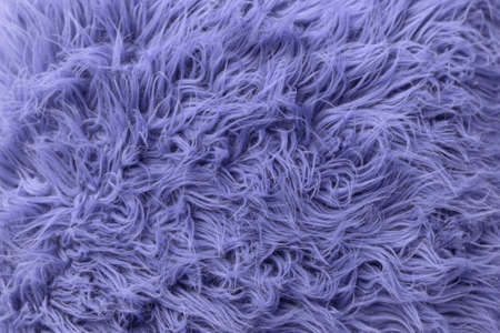 Purple soft fur for background or texture. Fluffy blue fur blanket. The color of 2022 very peri. Flat lay, top view, copy spaceの写真素材