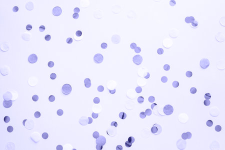 Violet and round confetti on a purple pastel background in very peri colors. Color of the year 2022. Template for advertising, blog, discounts and textの写真素材