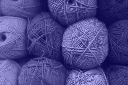 Purple wool skeins of the year 2022 are very peri. Trends and fashion concept.の写真素材