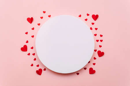 White circle and red hearts on a pink background. Valentine's Day. The 14th of February. Mock upの写真素材