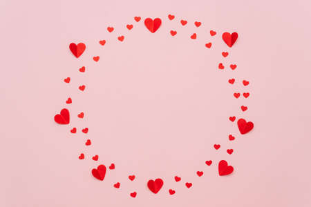 Creative circle made of paper hearts on a pink background. Layout. Love minimal concept - Valentines Day, March 8 or mothers day creative layout.の写真素材