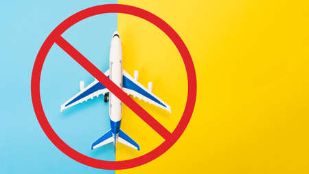 Abstract runway with an airplane model. Template for advertising flights. Coronavirus pandemic. Restriction of civilian flights, cancellation of flights on airplanesの写真素材