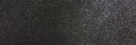 Black shiny background with sparkles. Dark gray abstract festive background. Web bannerの写真素材