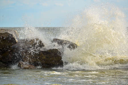 Waves and drops of water on the shoreの写真素材