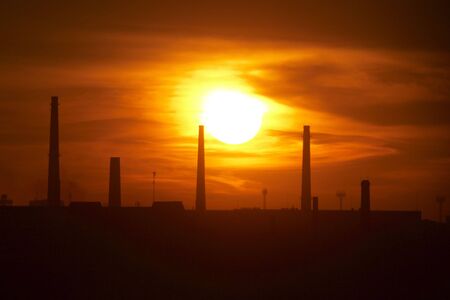 Sunset in the city with the view of pipesの写真素材