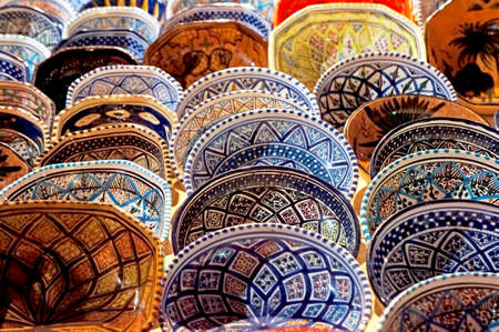 Handmade Tunisian decorated plates in a marketplace の写真素材