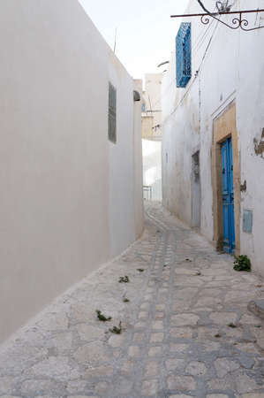 Tunisian foreshortening of medina in Sousse with white architectures