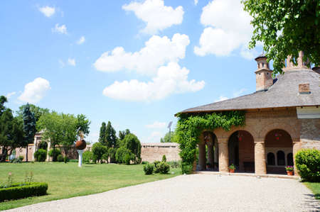 The courtyard of the Mogosaia Palace in Romania with its green garden のeditorial素材