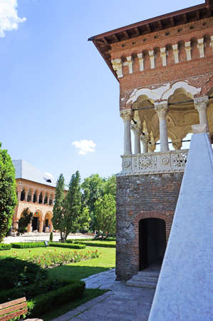 The courtyard of the Mogosaia Palace in Romania with its green gardenのeditorial素材