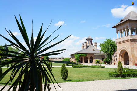 The courtyard of the Mogosaia Palace in Romania with its green gardenのeditorial素材