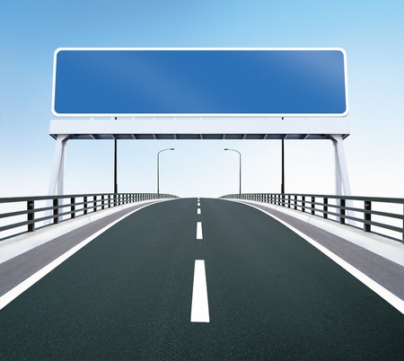 A highway of a bridge  A blank highway sign with room for your textの写真素材