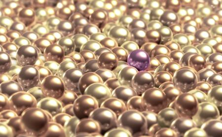 A purple pearl stands out from the other creamy pearls の写真素材