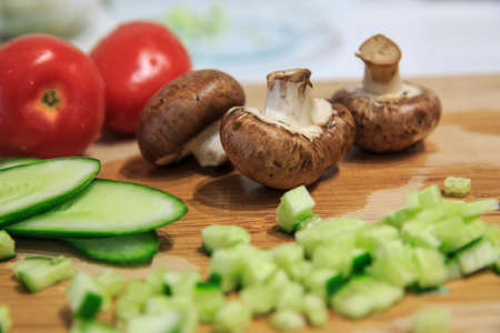 Salad of cucumber tomatos and mushroomsの写真素材