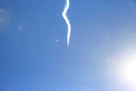 Trace of an airplane in the blue sky