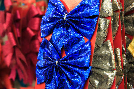 Two glossy blue bows for christmas