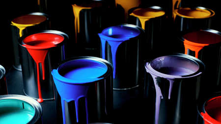 Cans of paint on a dark background